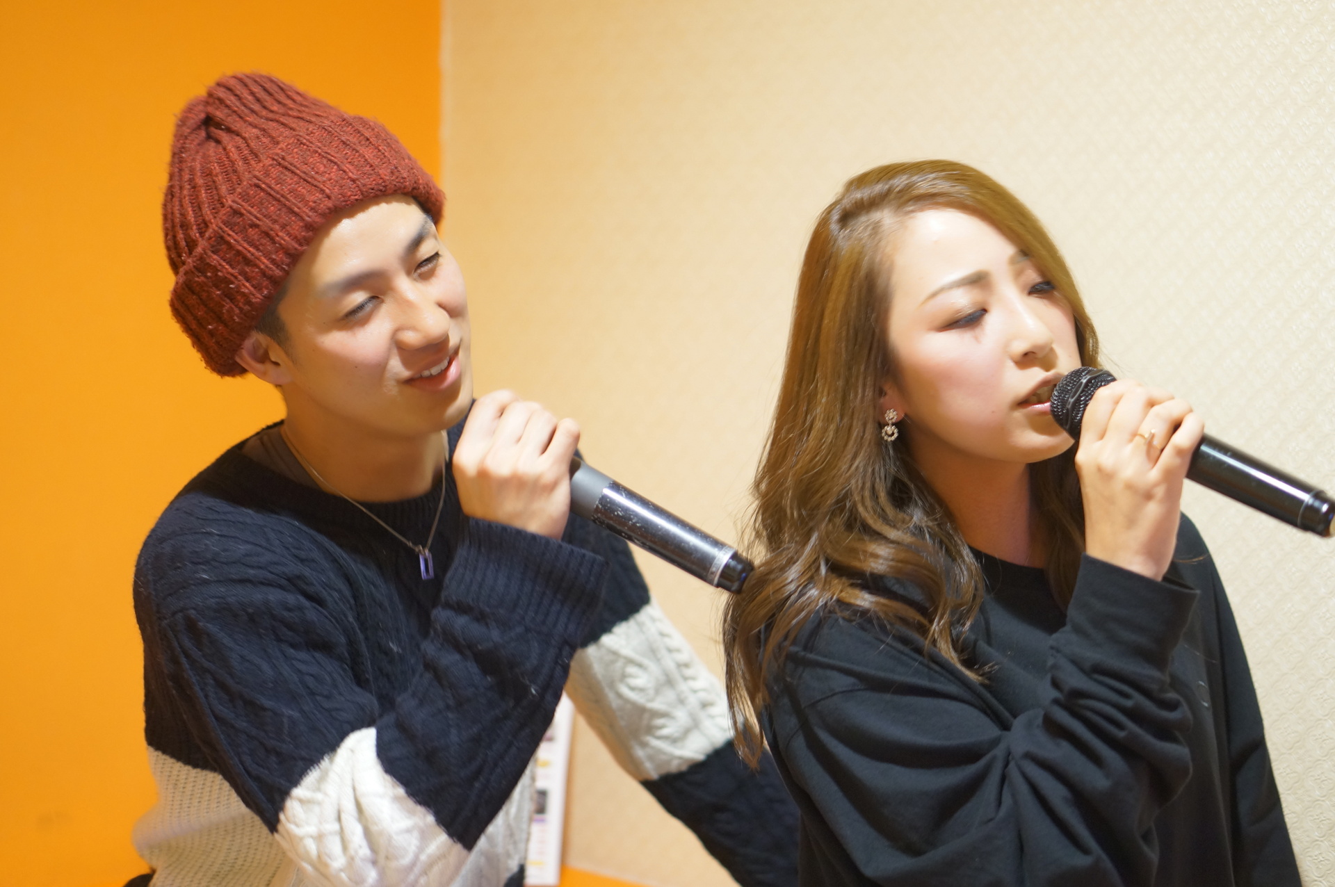 Music brings two people closer together on a karaoke date